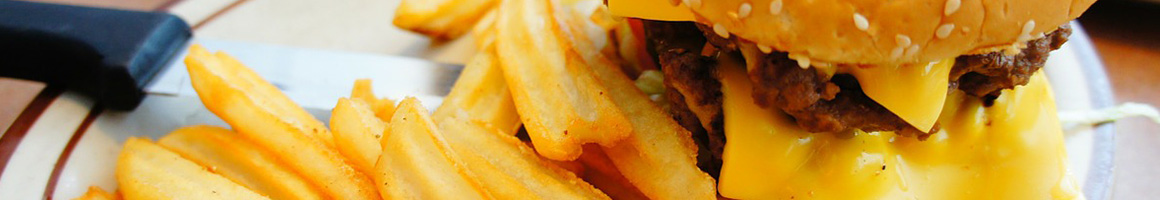 Eating Barbeque Burger Sandwich at Susie's Branding Iron Restaurant restaurant in Moab, UT.